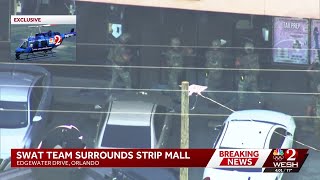 Roads reopen after barricaded suspect draws large police response to Orlando strip mall