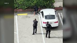 Video shows LAPD officers confront, shoot stabbing suspect in Vermont Avenue parking lot