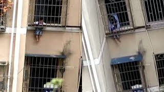 Firefighters rescue toddler stuck between window bars on third floor