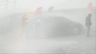 Giant wave soaks policemen: Officers get hit by wave as they stop to take photos in Dorset