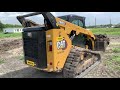 cat 299d3 moving dirt