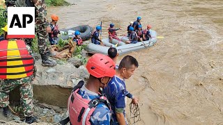 Two buses carrying at least 60 people swept into river by landslide in Nepal