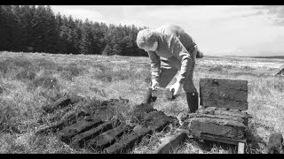 The Capanagh Turfman cutting Peat and Turf filmed  in a bog in Co. Antrim Northern Ireland