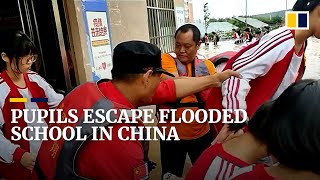 Students trapped in flooded classrooms rescued in China’s Henan province