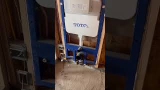 Wall mount toto toilet.#plumbing #construction #shorts #viral #milwaukeetools #homerepair #diy