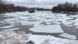 Canadian coast guard hovercraft breaks ice chateauguay river