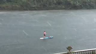 Topless Paddleboarder Takes to River Thames During Hailstorm