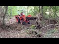 kubota l2501 clearing land and pulling trees out