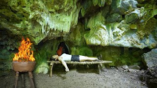 Strong girl builds a shelter in a big rock Bushcraft survival skills