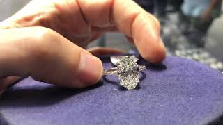 What is a 5 carat oval shaped diamond engagement ring look like? H VS2