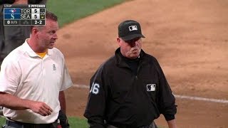 TOR@SEA: Umpire Joyce leaves after being struck