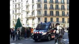 Police vehicles of the Mossos d'esquadra race through Barcelona city streets