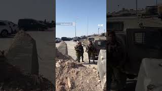 Israeli forces prevent an ambulance carrying a patient from passing through in the West Bank