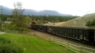 CP local passing through with three BNSF low side gondolas