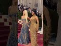 Cardi B with Donatella Versace at the Met Gala's red carpet 💛