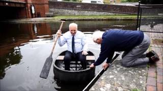 Malcolm Douglas attempts to row a coracle in Welshpool