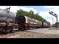 a pair of canadian national emds on csx mixed freight train