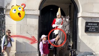 Lady keeps Touching the King's Horse REINS