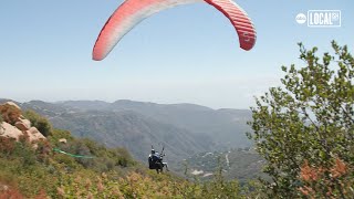 Experience breathtaking views while paragliding over Malibu