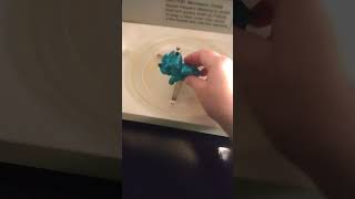 BLUE GLITTER DINOSAUR ORNAMENT IN THE MICROWAVE