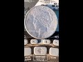 metal detecting beautiful old silver peace dollar revisited. short