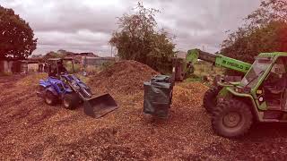 Multione 8.4s loading wood chip in to bulk bags