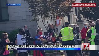 Police use pepper spray, arrest 8 demonstrators at Graham voting rally