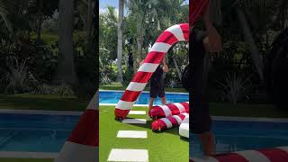 Inflatable Candy Cane Fun: The Viral Christmas Sensation 🎅🍬 #HolidayCheer #ViralHit”