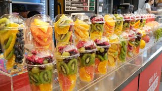 100% fresh fruit! Gwangjang Market fruit shop owner cutting fresh and clean cup fruit