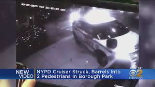 NYPD Cruiser Struck, Jumps Curb In Borough Park