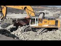 liebherr 974 excavator loading mercedes and man trucks