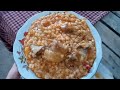 rice pilaf with meat on a wood fire in the village.