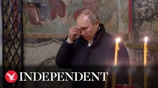 Vladimir Putin attends Orthodox Christmas service alone