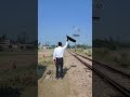 সবুজ পতাকা দেখিয়ে ট্রেন আসার সিগনাল signal of train coming by showing green flag train railway