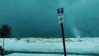 Waterspout comes ashore on Lake Michigan beach