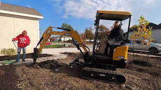 SANY SY16 mini excavator pulling pipe in the ground with a plow blade