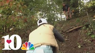 Fairview resident only able to reach his home up a steep embankment he carved after flood