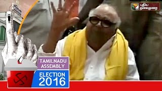 DMK President Karunanidhi casts his vote at a polling booth in Gopalapuram