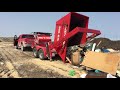 red e bins trailer dumping bin full of garbage