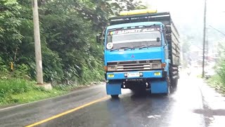 Mitsubishi Trucks And Toyota Trucks That Are Heavily Loaded