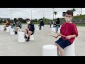 These kids are finding their rhythm through bucket drumming!