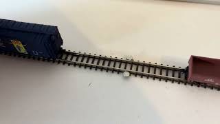 Z-Scale uncoupling with Micro-Trains magnematic couplers using neodymium magnets glued on track.