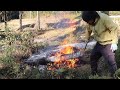 the heat from the fire is comforting burning dead bamboo in the cold to make way for field work