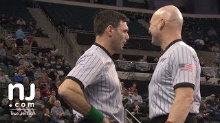 Beyond whistles: Watch 2 mic’d wrestling refs in action at the State Championships