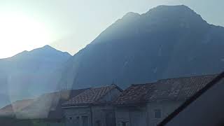 Driving through Erto, mists rising from the Vajont lake, early morning. Erto, Friuli, Italy 15/08/21