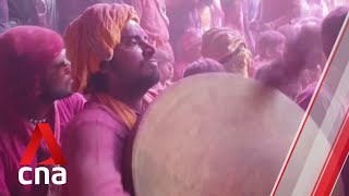 Devotees gather in India to celebrate Holi festival of colours despite surge in COVID-19 cases