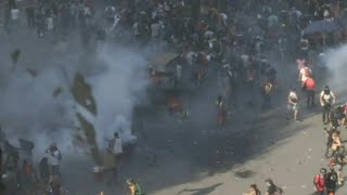 Police in Chile fire tear gas on protesters in Santiago plaza | AFP