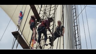 Girls swinging in the mast of Wylde Swan