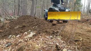 Snowplow on 4 wheeler pushing dirt