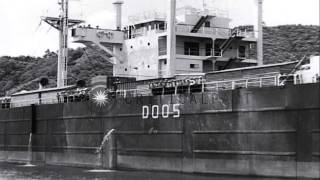 Daiiku Maru ship underway in sea and Japanese repatriates arrive in trucks and a ...HD Stock Footage